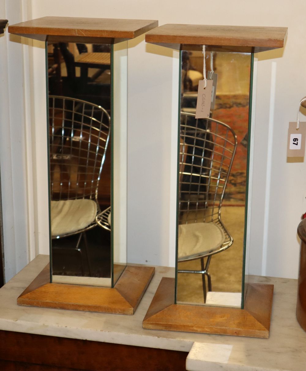 A pair of mirrored beech pedestals, W.25cm, H.58cm